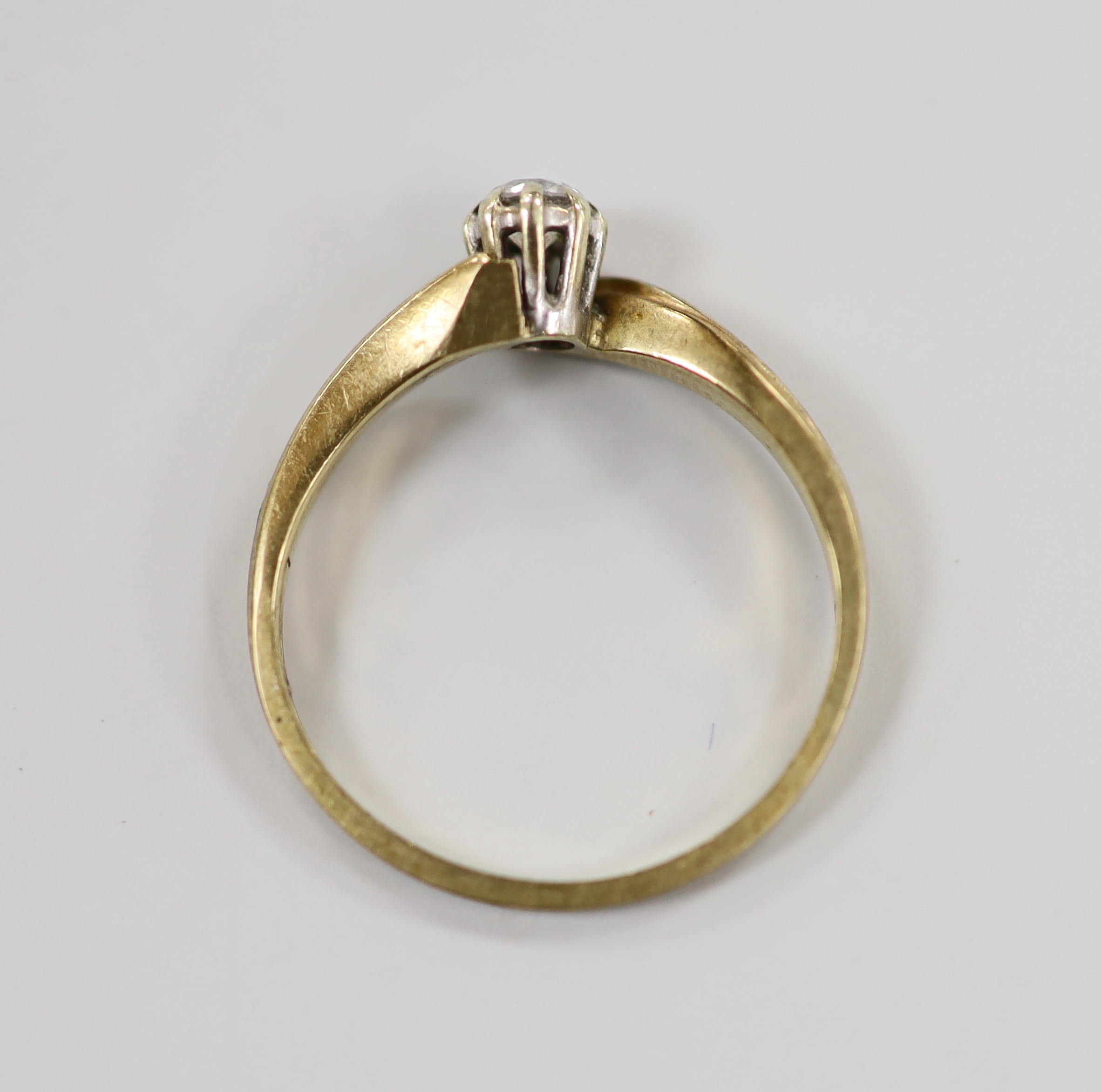 A modern 9ct gold and solitaire diamond ring, size M, gross weight 1.9 grams.